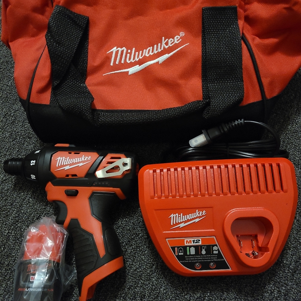 Milwaukee impact gun with bag battery bits and instructions